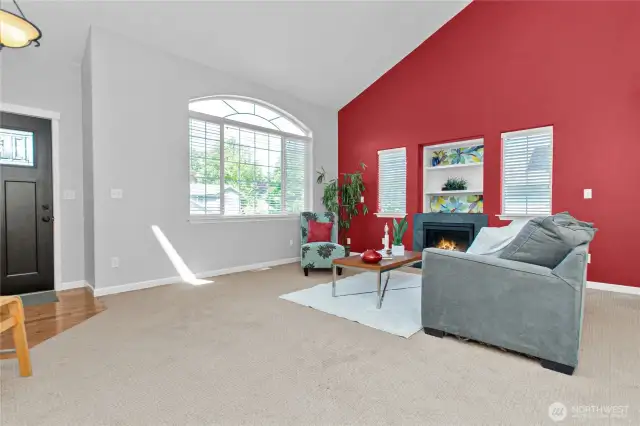 Enjoy the open living space with gas log fireplace ...