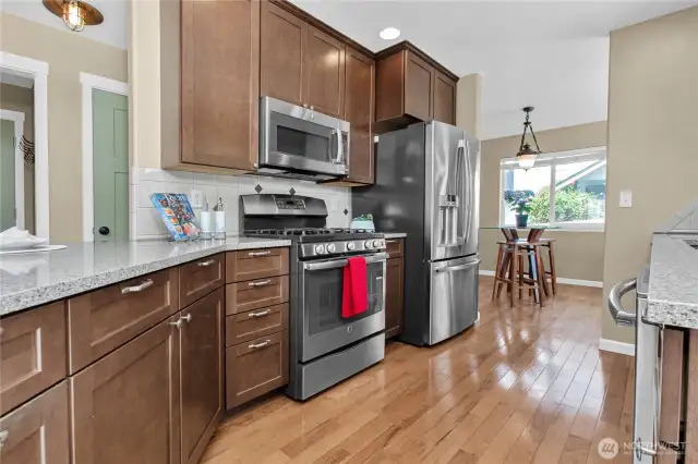 The cook will love the updated kitchen with quarttz counters, stainless steel appliances (stay), recessed lighting ...