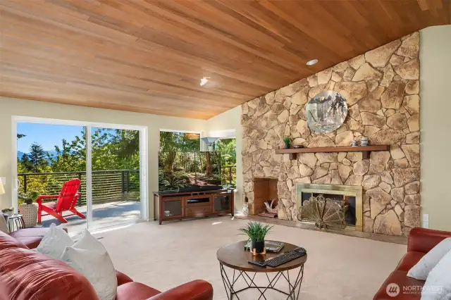 The cedar ceiling offers a fantastic vault - the wood burning fireplace is a focal point.