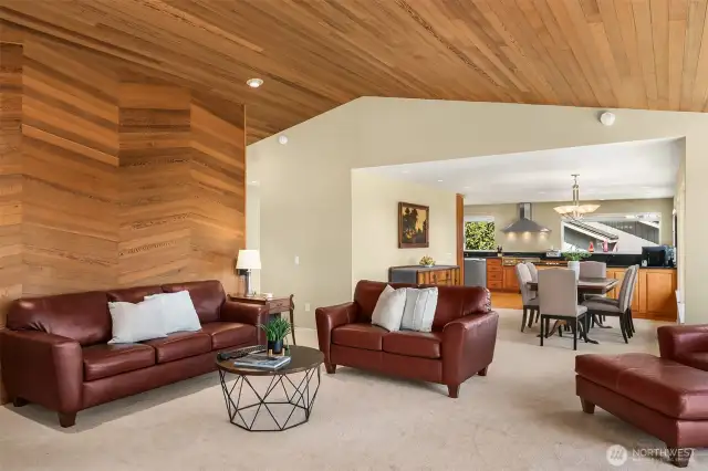 A marriage of rooms for easy entertaining and function. The living room adjoins the dining room and kitchen.