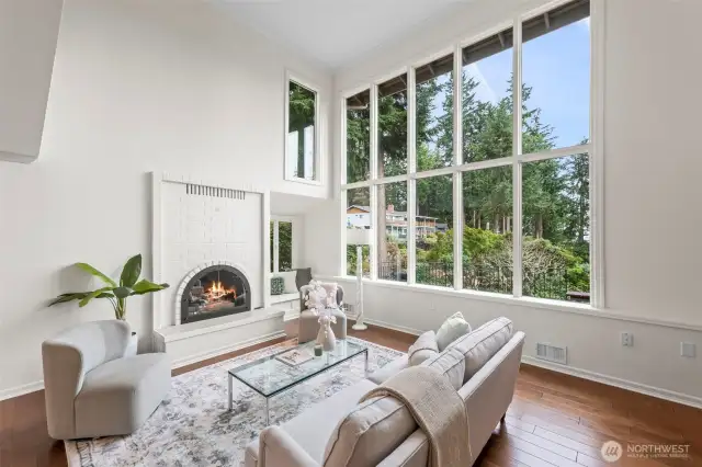 Cozy brick fireplace adds character to this beautiful living room.