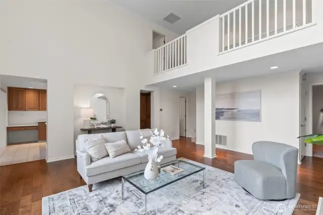 The second floor has an open loft-like hallway area that looks down into the living room.