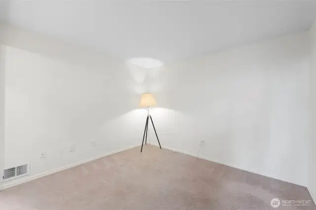 Newer carpet throughout the condo, including this main floor bedroom.