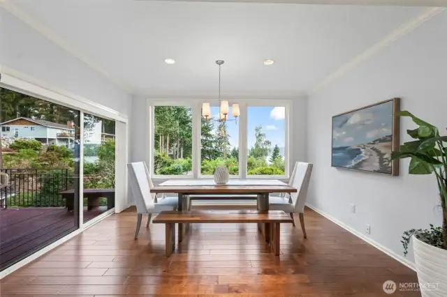 The dining room enjoys the fantastic water view with a slider to the deck.