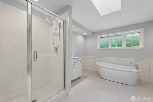 Primary ensuite creates a spa-like feel with calming colors & oversized skylight.