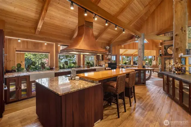 Chef's kitchen with walk-in pantry, double fridge, double sinks, and a work station