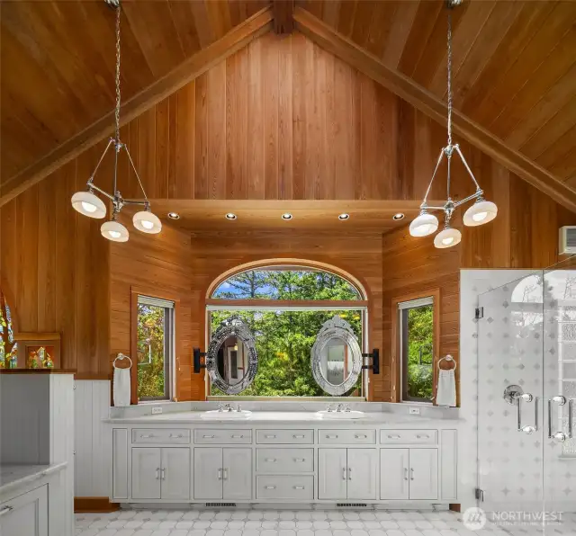 Primary bath w. a grand claw-tub facing the ocean, a large walk-in closet, fireplace lounge, work-station and plenty of natural lighting