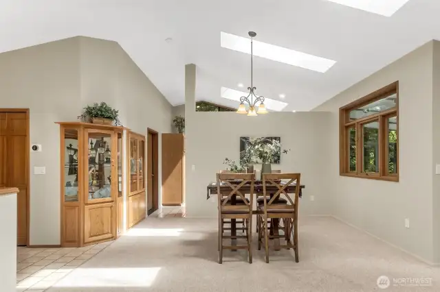 The kitchen is tucked just around the corner, separated from the living space by a three-quarter-height non-load-bearing wall.