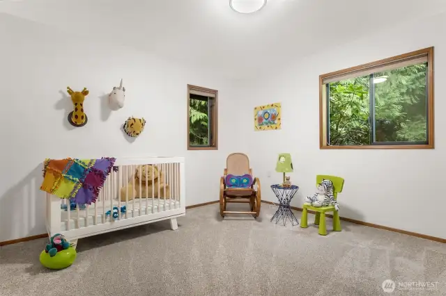 Two additional bedrooms are located on the main floor.