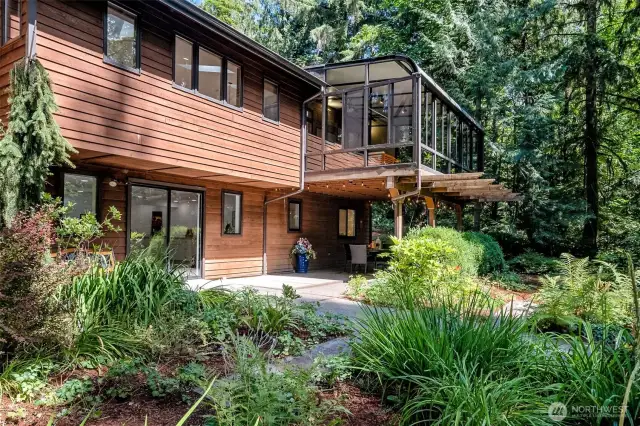A second view of the back of the home! So peaceful with the paths, pavers and lovely landscaping.