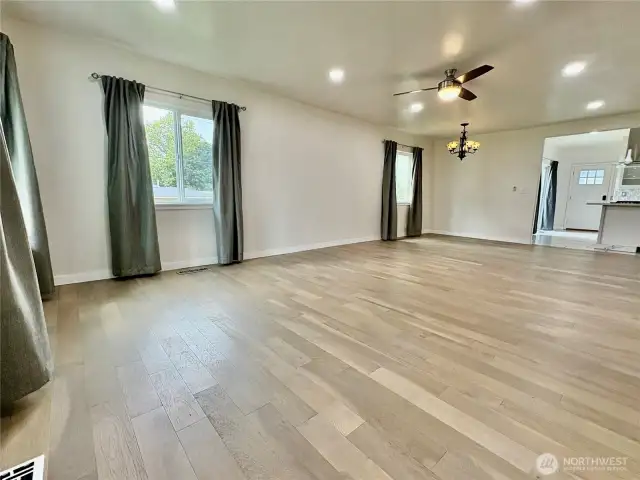 Large main living space with new engineered hardwood floors.