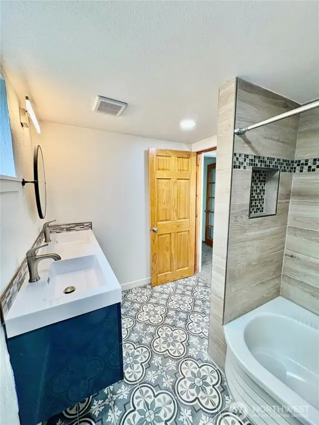 Full bathroom with double sinks upstairs.
