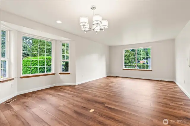 Gleaming new LVP plank flooring throughout