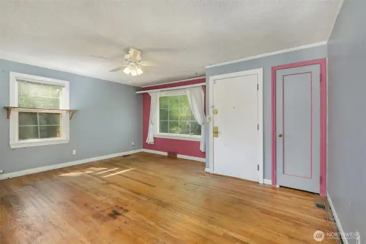 Living room, entry plus a large coat closet-triple paned windows!