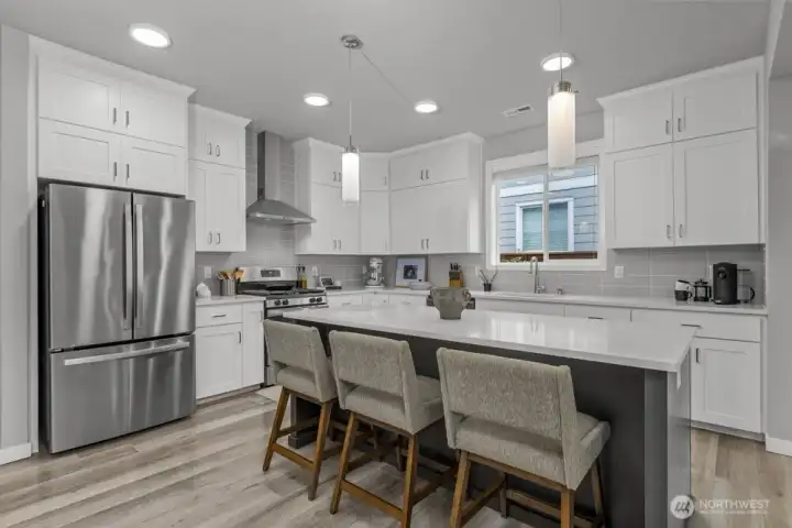 A spacious island ready for casual meals or weekend baking sessions.