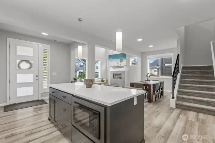 The open layout  highlights tall ceilings, big windows, and sightlines that show off a home’s best features.