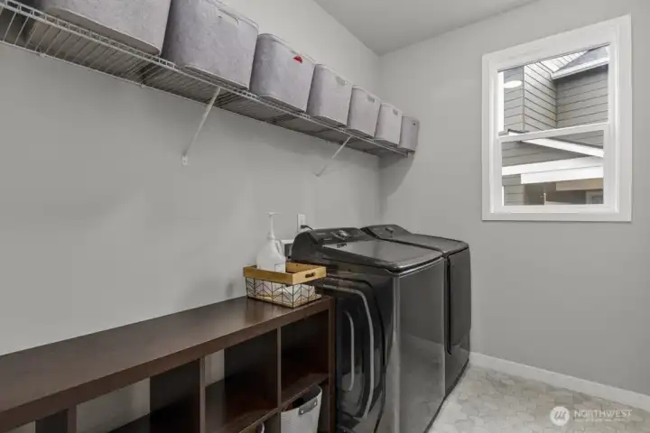 Another generous sized laundry room with natural light.