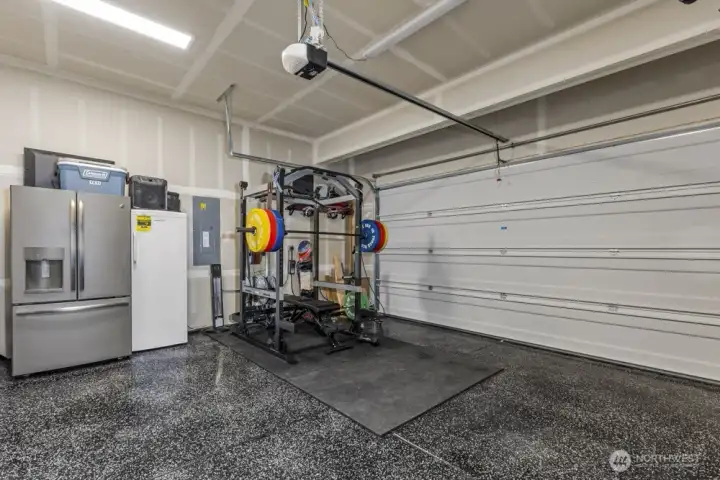 Look at this clean garage with polyurea coated flooring.