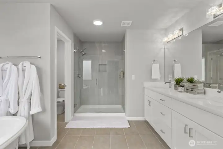 Luxurious primary suite is a true retreat.