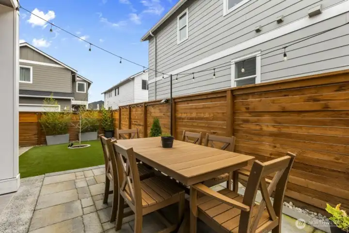 A cozy outdoor living area makes it easy to kick back with a book, sip your morning coffee, or host friends for a BBQ.