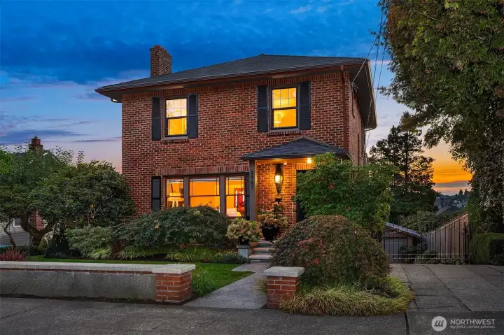 Beautifully sited and wrapped in thoughtfully landscaped gardens.This 1924 Colonial has had the entire brick exterior re-tuckpointed and installed cement fiber siding. New Legacy Roof in 2018.