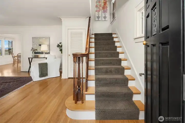 Eye-catching details welcome you inside such as the  original wood banister.