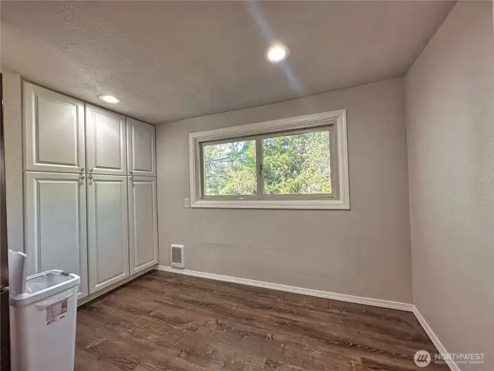Dining space off kitchen with large wall pantry