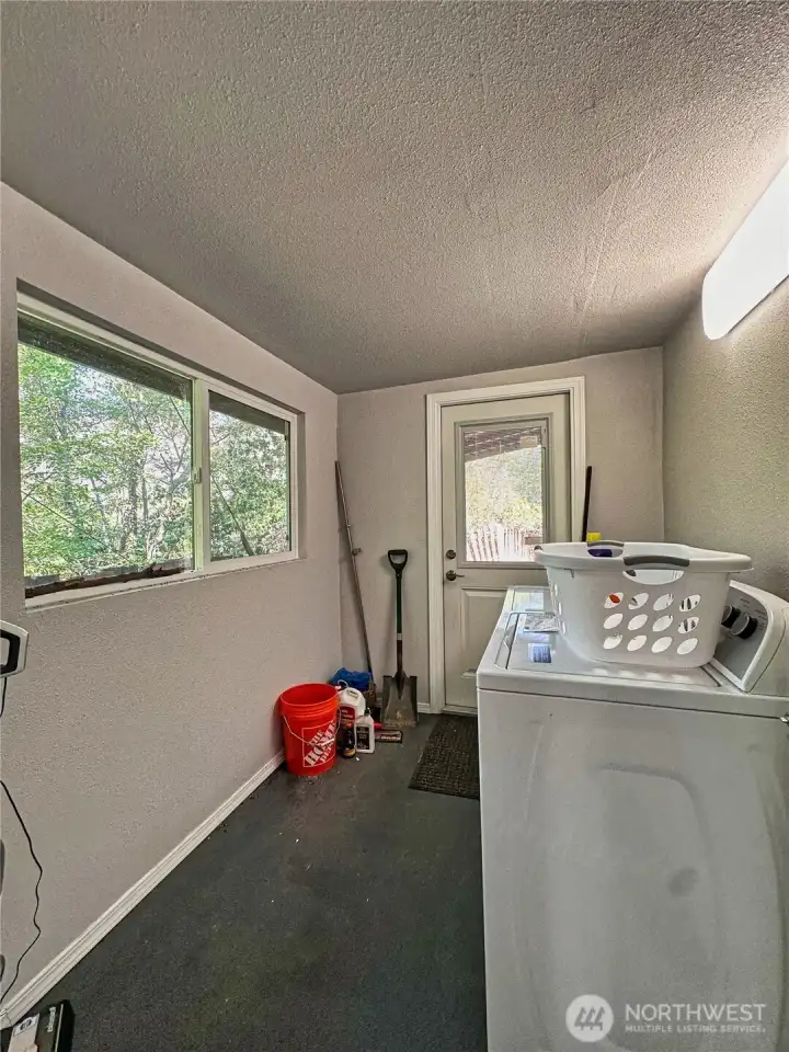 Sizable laundry/mud room. Washer/Dryer convey with sale.