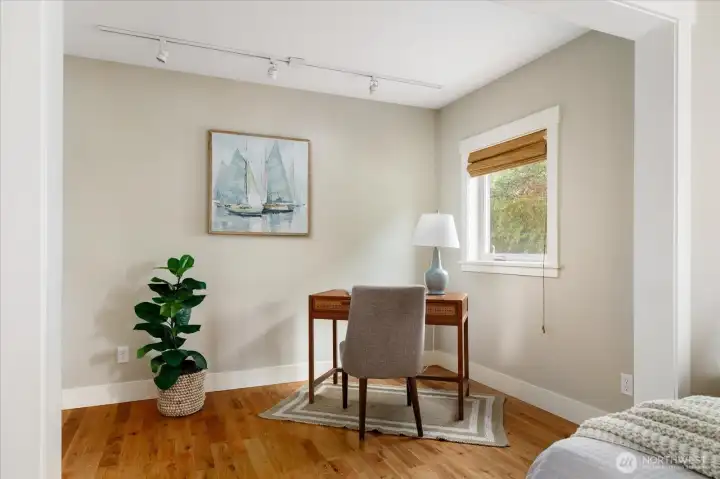 Office nook or sitting room provides options for the primary bedroom space.