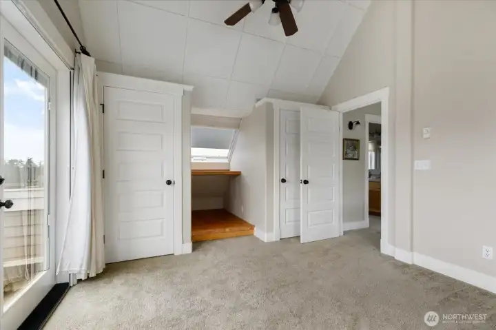 Nice use of space and daylight, closets and built-in desk tucked into the eaves.