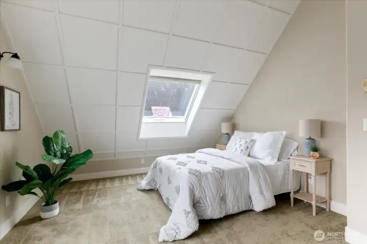 Upstairs skylights create a bright and inviting space.