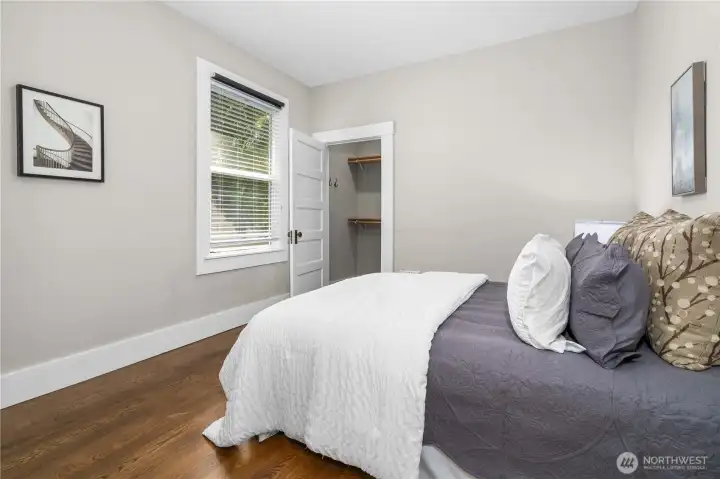 Spacious Main Floor 1st Bedroom with Walk in Closet & Shelving
