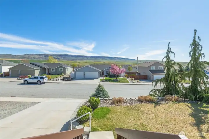 Street ,wheat fields and basalt mountain backdrop views