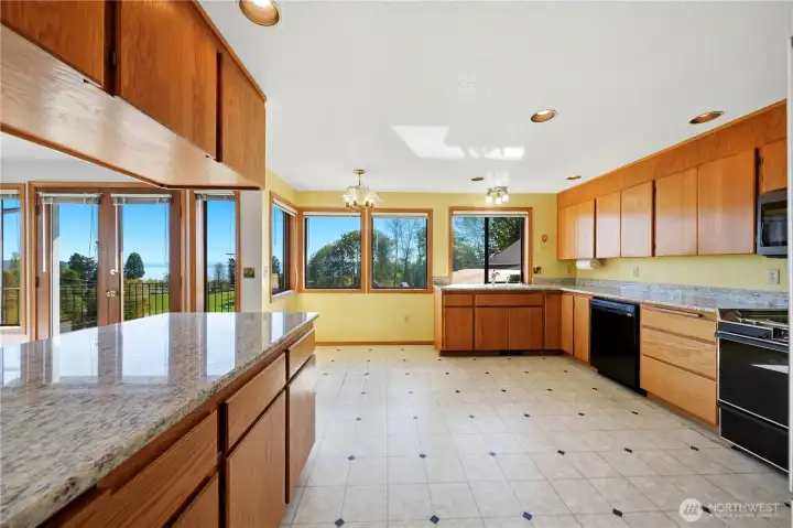 Kitchen has loads of cupboards and counter space.