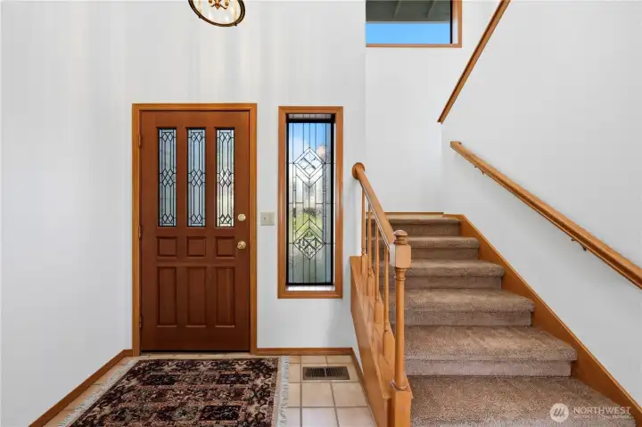 Stairway heading up to the second floor from the main entry.
