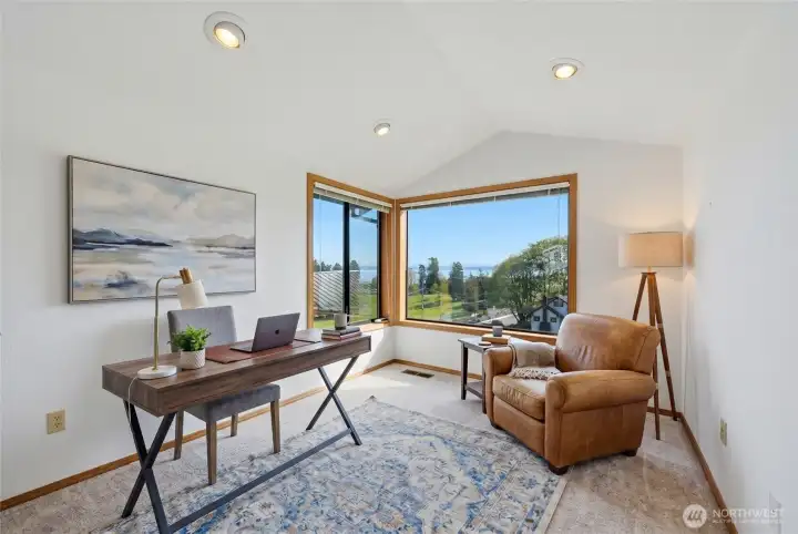 Sitting room at the top of the stairs with a killer view! (This photo is virtually staged).