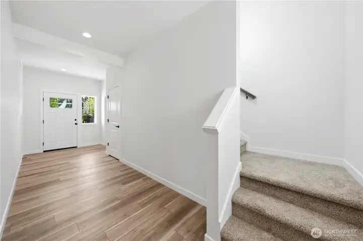 Front hallway and staircase to the upstairs.