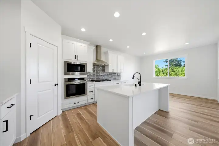 Kitchen with walk-in pantry and gas range