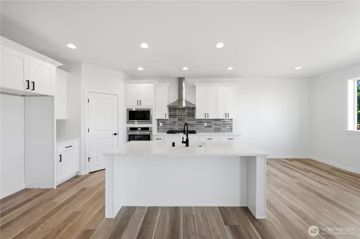 Kitchen with walk-in pantry and gas range
