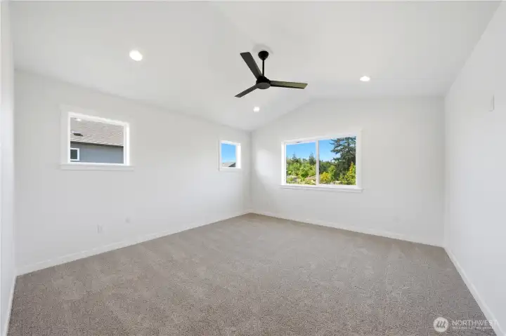 Primary bedroom with ceiling fan