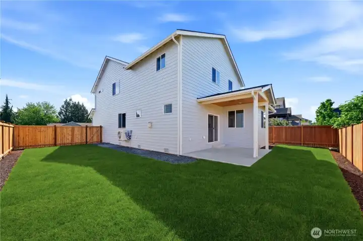 Spacious backyard with evening sun perfect for entertaining