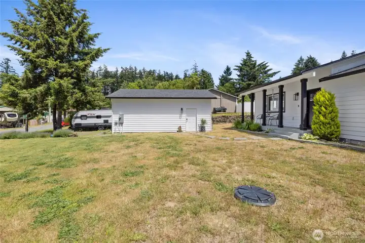 detached garage offers PLENTY of storage space for all of your vehicles and recreational items.