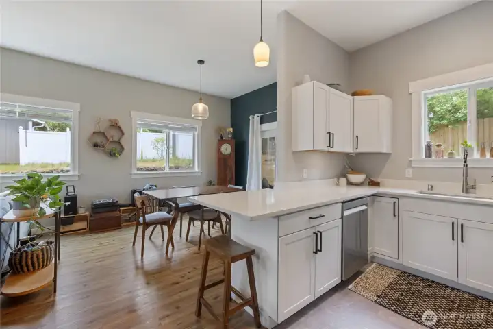 Shaker cabinets with a breakfast bar makes an inviting heart of the home.