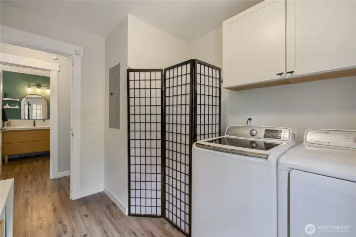 Adjacent is the utility space with full size washer and dryer...