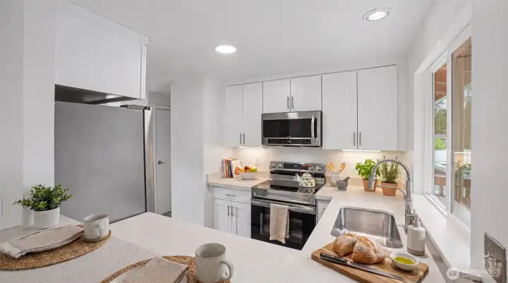 No shortage of countertop space in this well-adorned kitchen! Virtually staged. No shortage of countertop space in this well-adorned kitchen! Virtually staged.