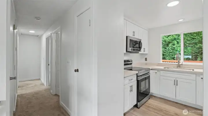 Upper Level hallway that leads to the Full Bathroom, Primary Bedroom and 2 additional Bedrooms. Upper Level hallway that leads to the Full Bathroom, Primary Bedroom and 2 additional Bedrooms.