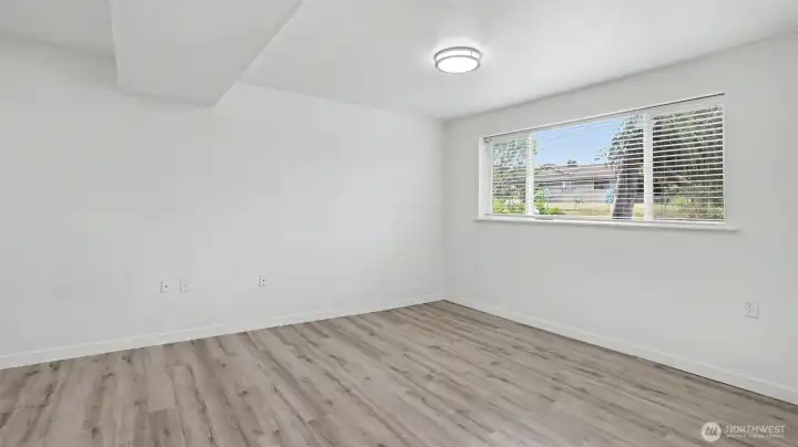 Updates in 2025 of the Rec Room include LVP flooring, light fixtures, blinds, base trim and fresh interior paint. Updates in 2025 of the Rec Room include LVP flooring, light fixtures, blinds, base trim and fresh interior paint.