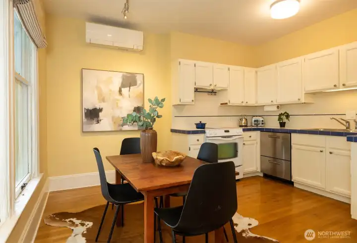 Open kitchen and dining area.  Note newer mini splits for cooling and heating.