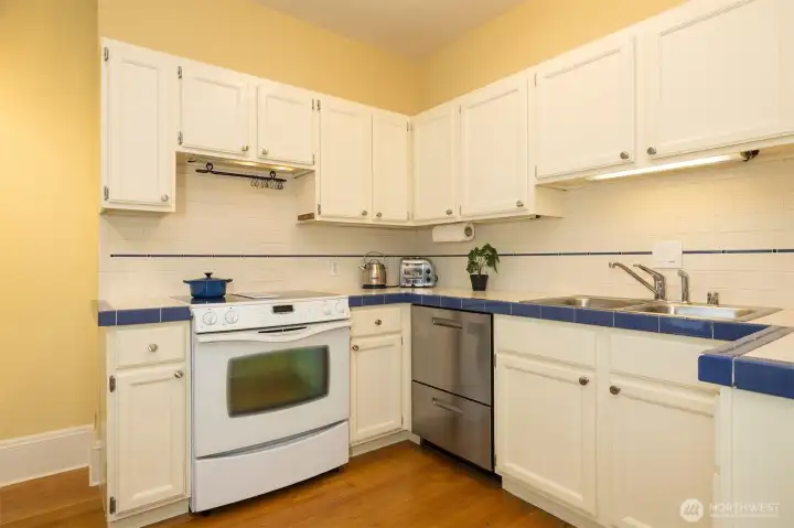 Charming kitchen has a brand new dishwasher and fridge.