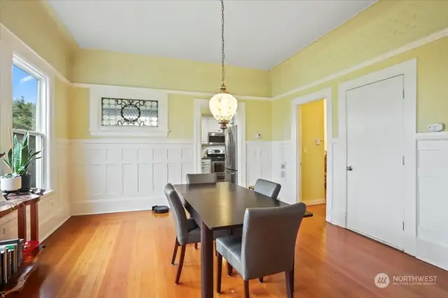 The dining room looking into the kitchen. Notice the stained glass window on the left.